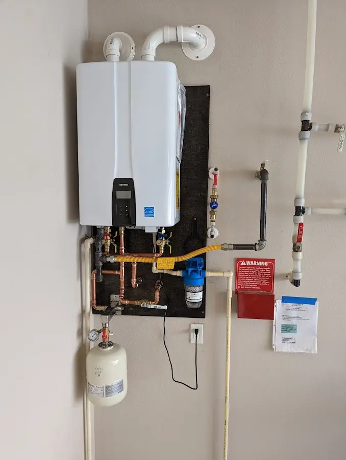 Professional plumber installing copper piping in a Star home